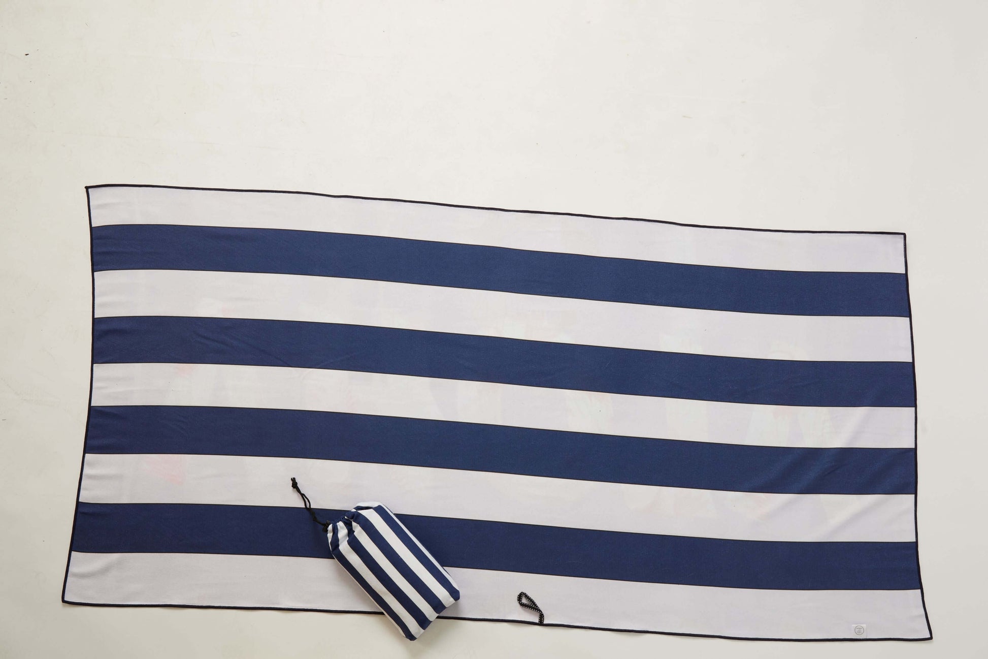 Oversized Aloha Micro Fiber Towel with navy and white stripes, ideal for beach or pool use.