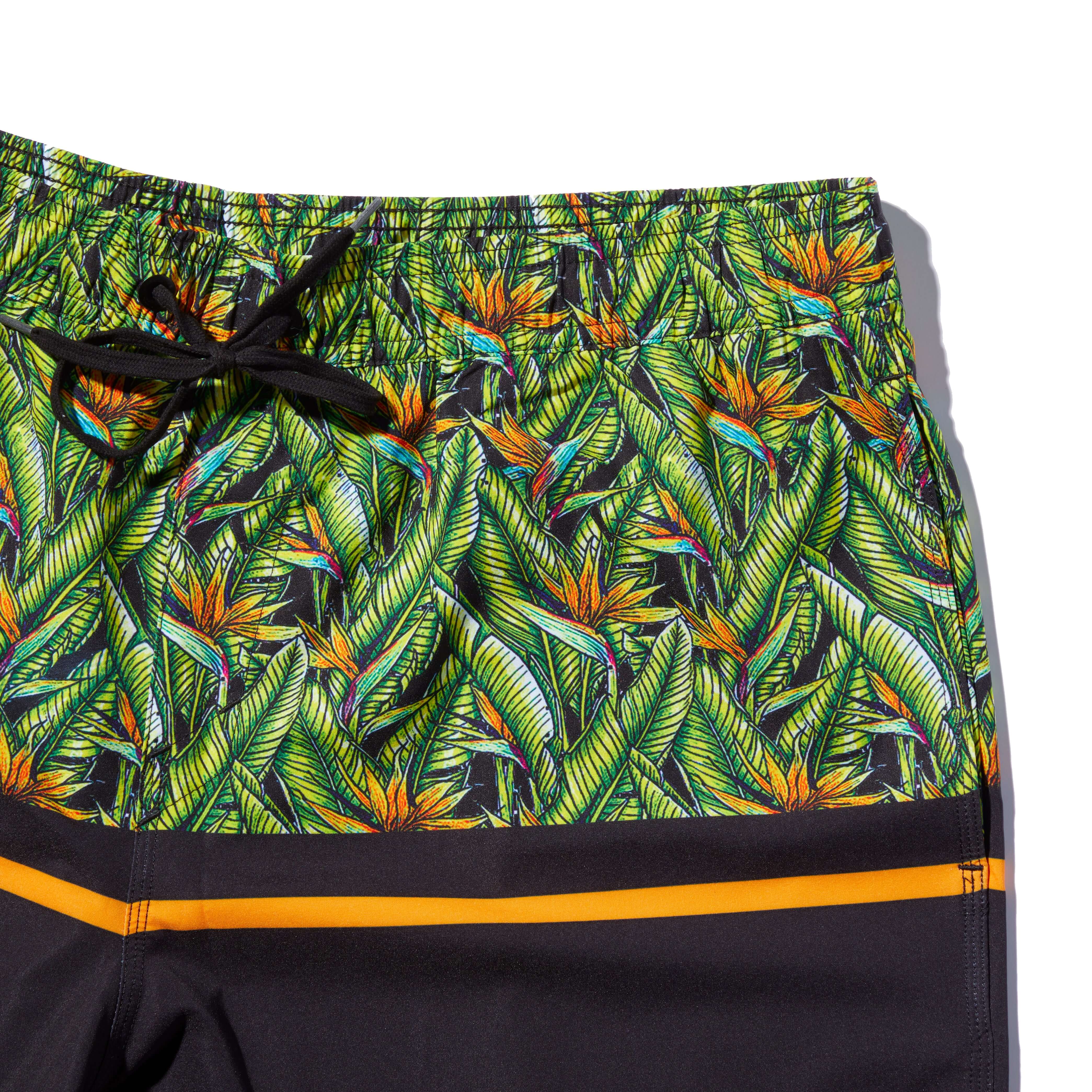 DaveL Manu Volley Short featuring vibrant tropical print and elastic waist for comfort and style.
