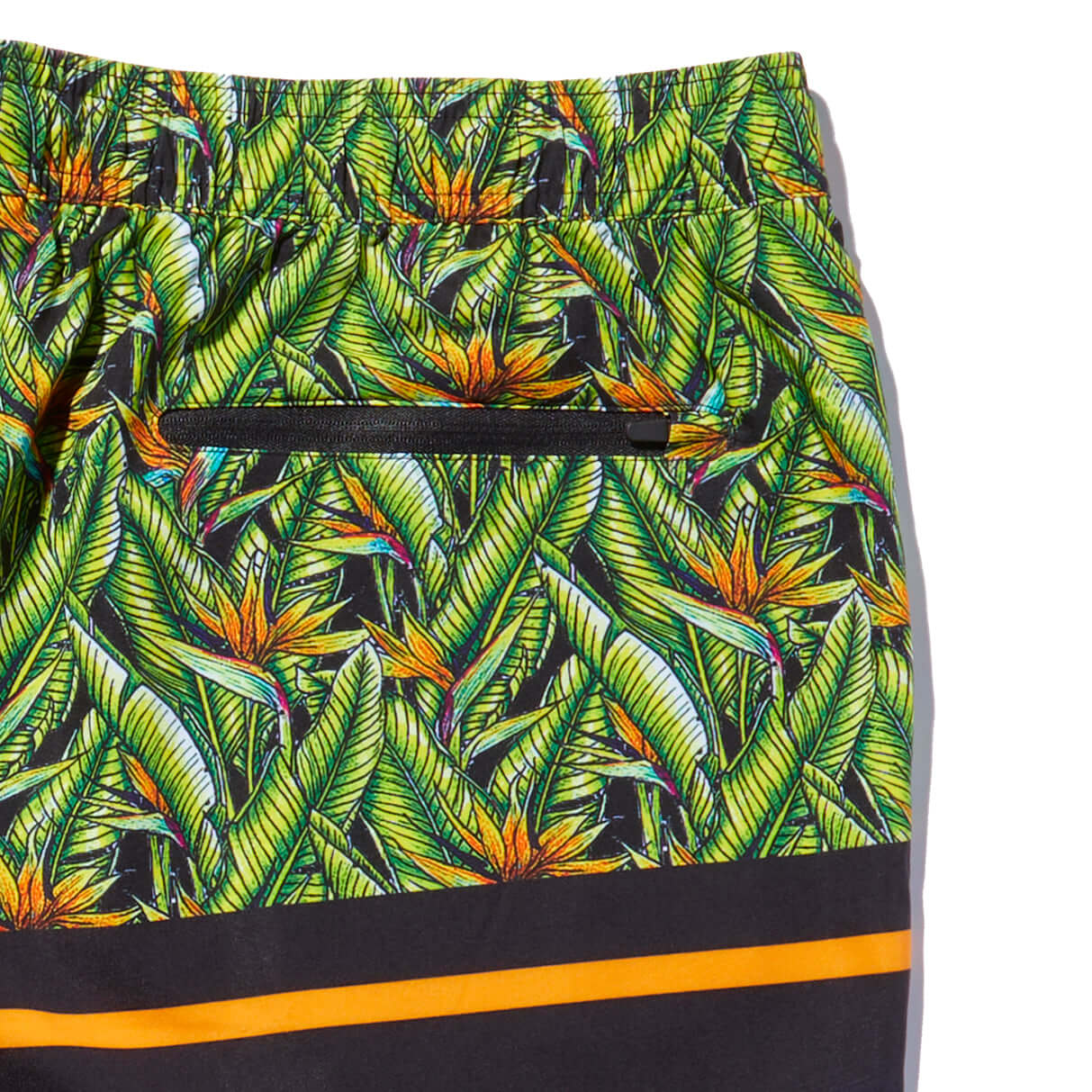 DaveL Manu Volley Short featuring vibrant tropical print and zip pocket detail for style and functionality.