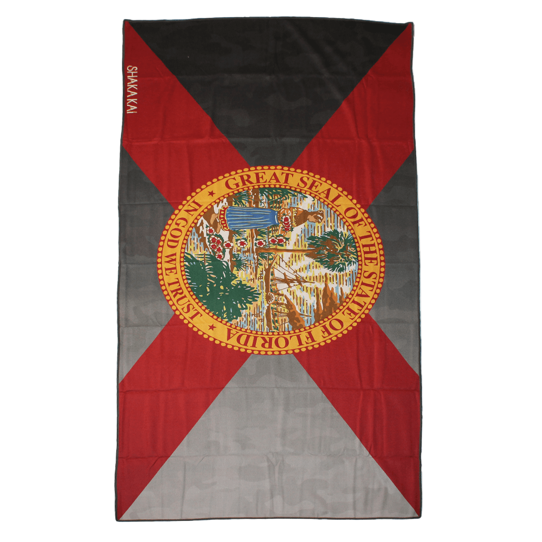 Flag with a central emblem and red, black, and gray design on a white background