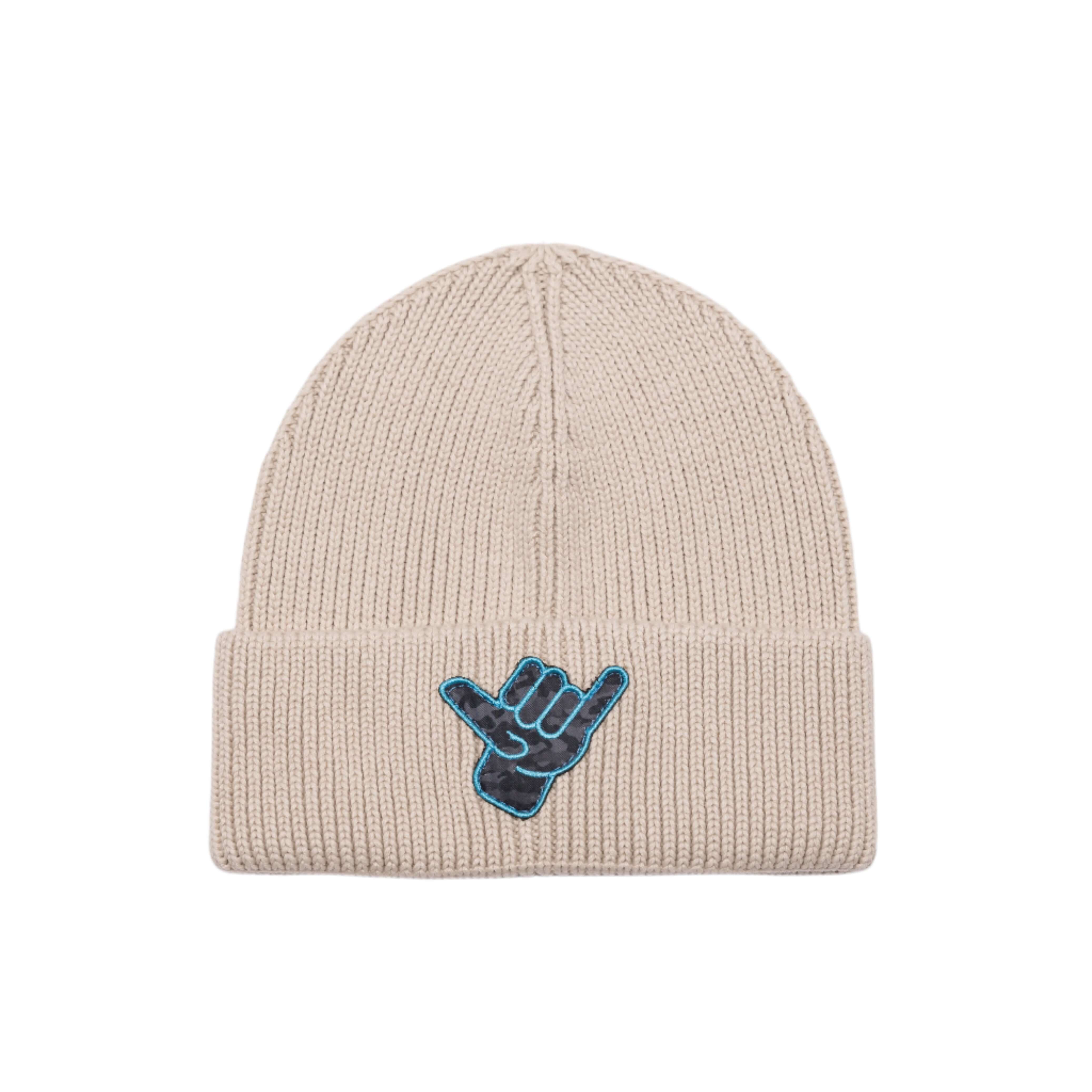 OG Shaka Beanie in beige with a custom Shaka Kai logo patch for winter surf vibes.