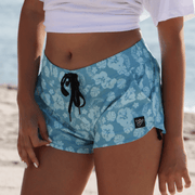 Plumeria Volley Shorts featuring a tropical floral design, ideal for beach activities and comfort.