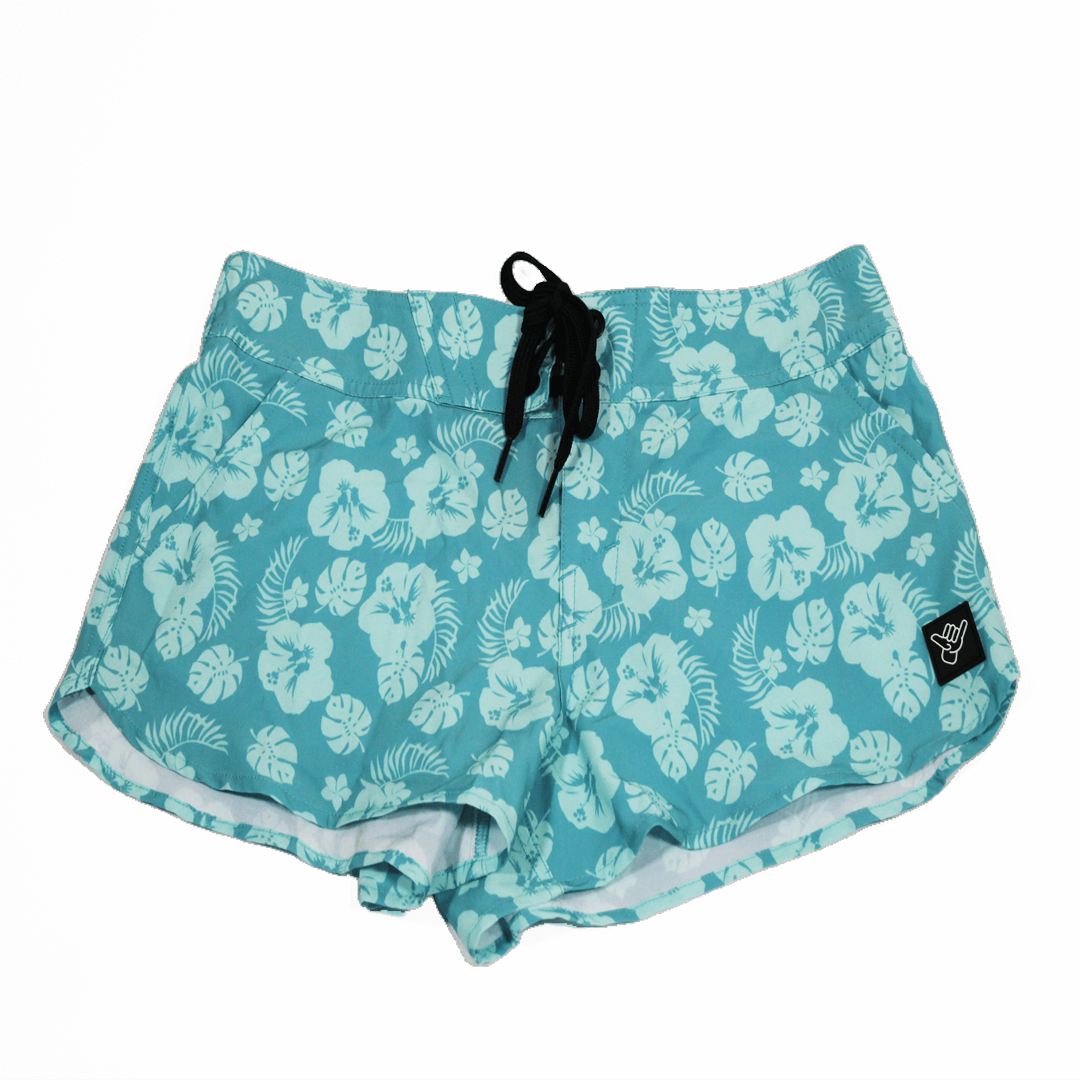 Plumeria Volley Shorts with a tropical floral design, perfect for beach activities and casual wear.