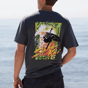 Man wearing a RAD T-Shirt with vibrant graphic design on the back, showcasing island vibes and beach energy.