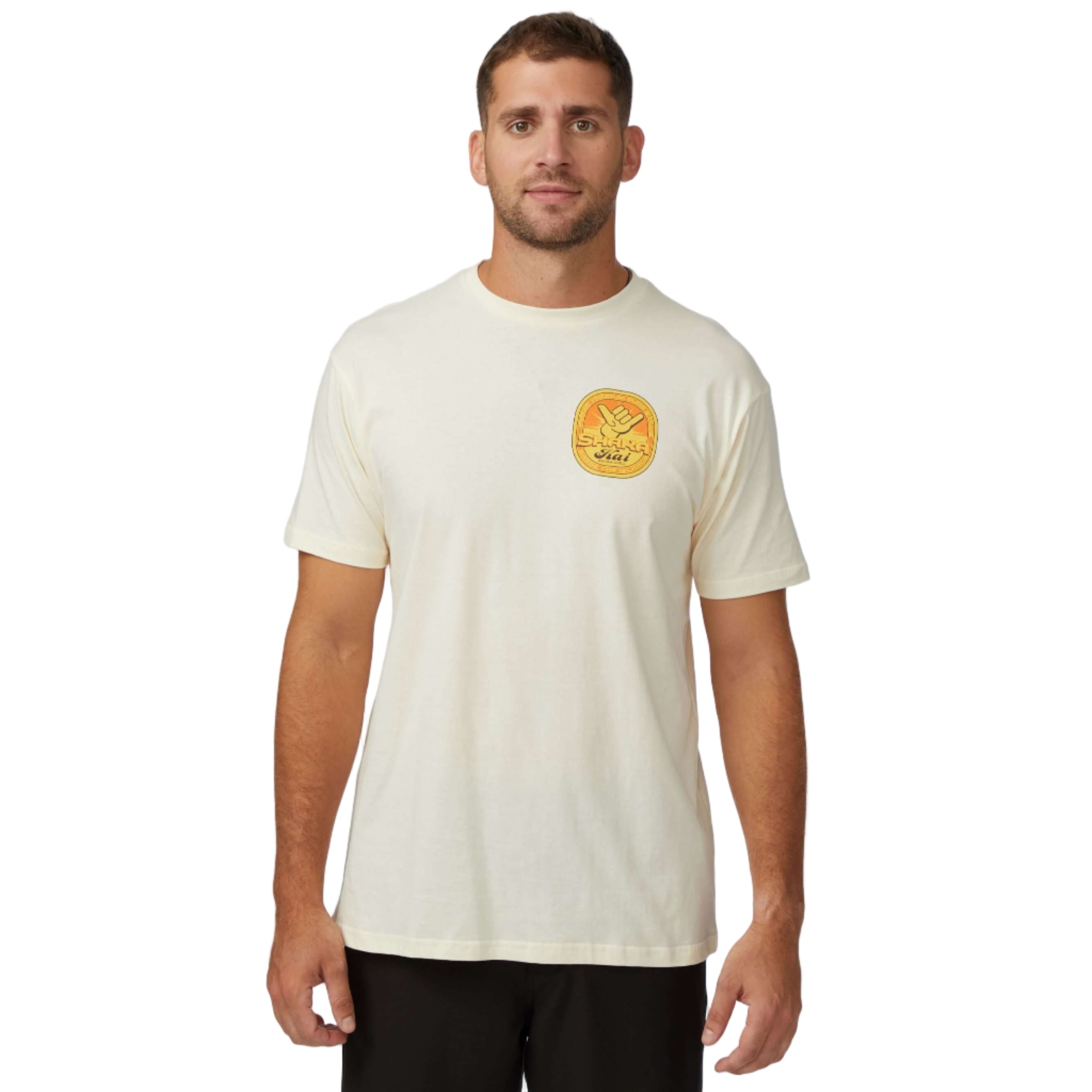 Man wearing Tapped Out T-Shirt in cream color, showcasing the vibrant graphic design on the chest.