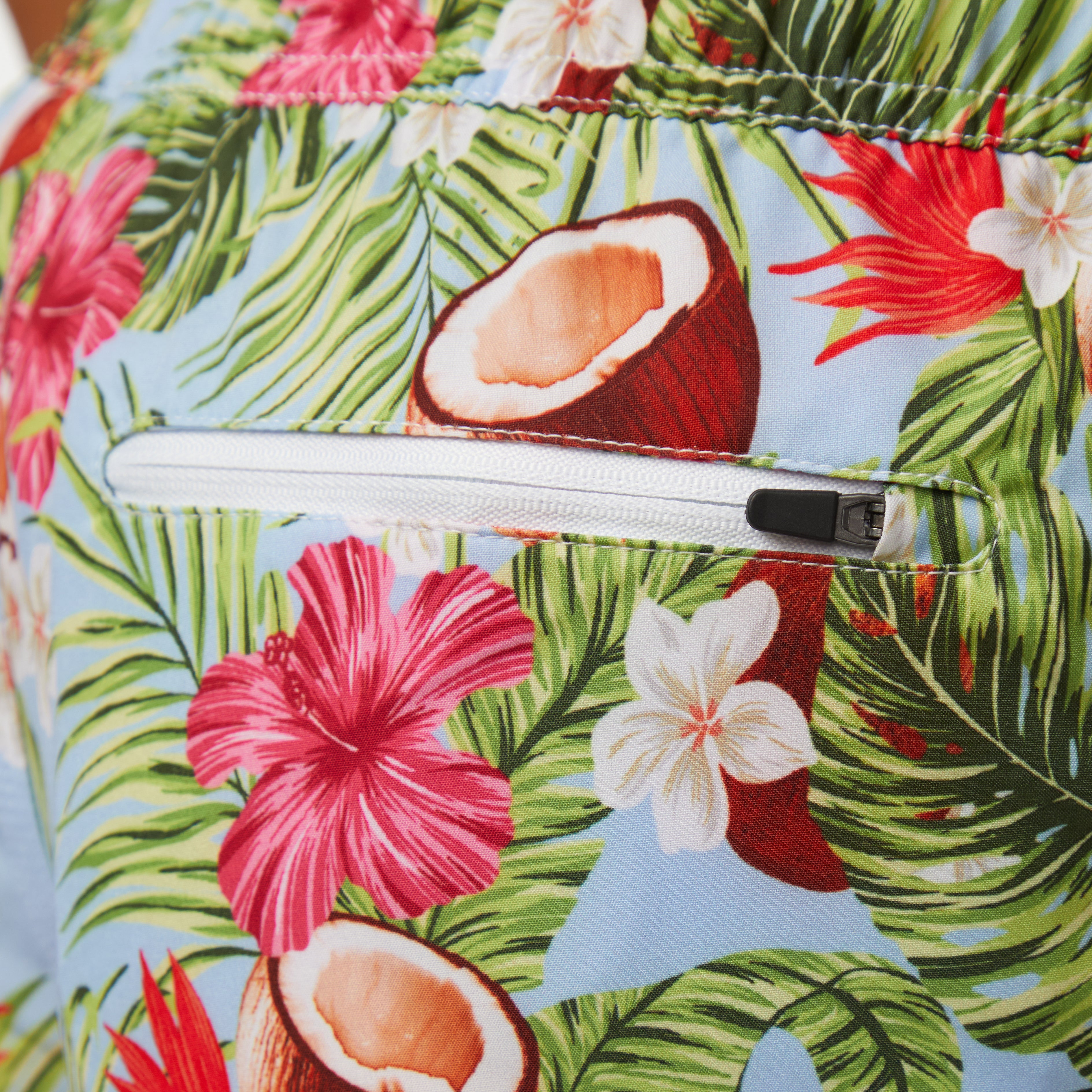 Coco Loco Volley Short with floral design and zipper back pocket for sun and surf activities.