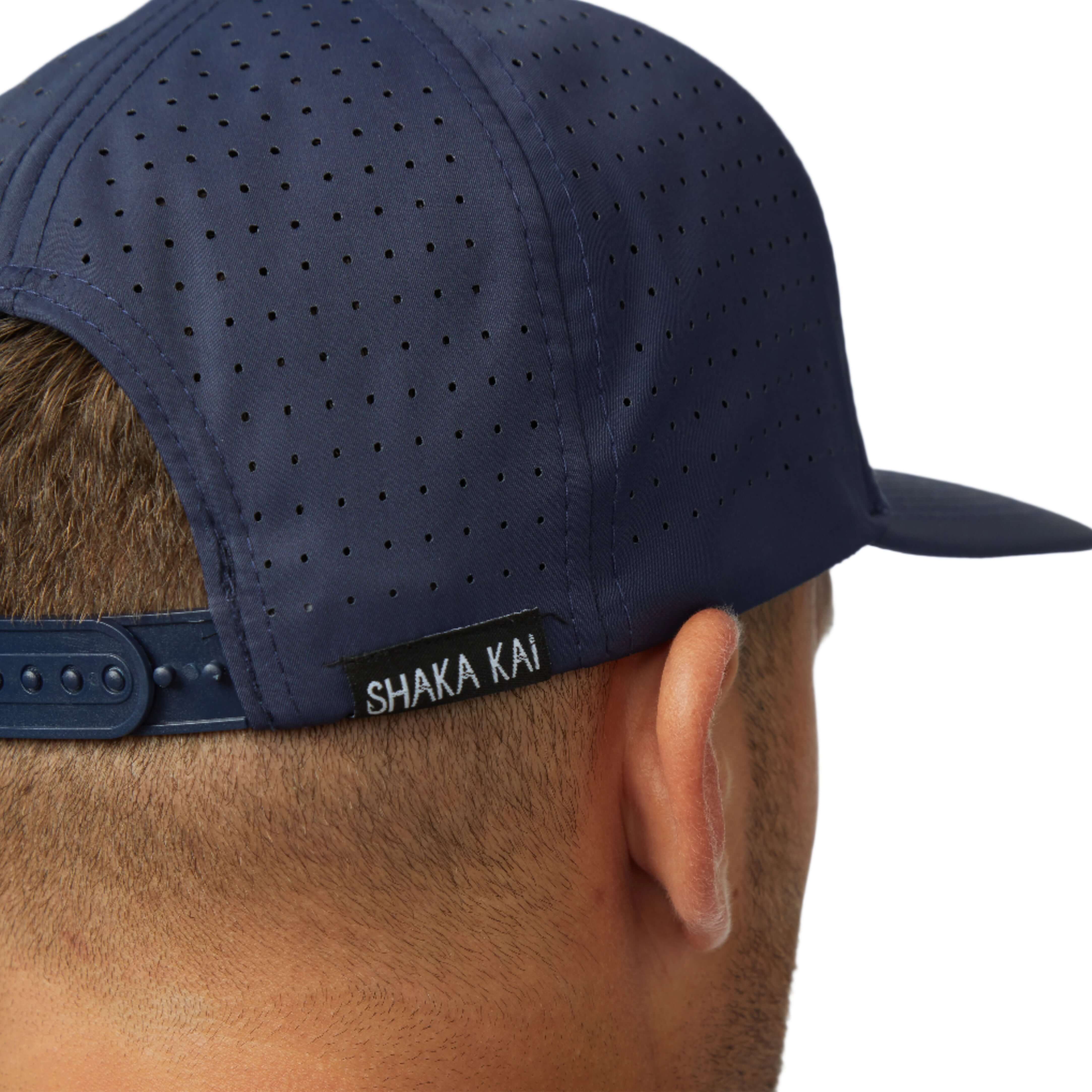 Close-up of the back of the DaveL Shaka-Shimi Mahi Ultra Fit hat showcasing breathable fabric and Shaka Kai tag.
