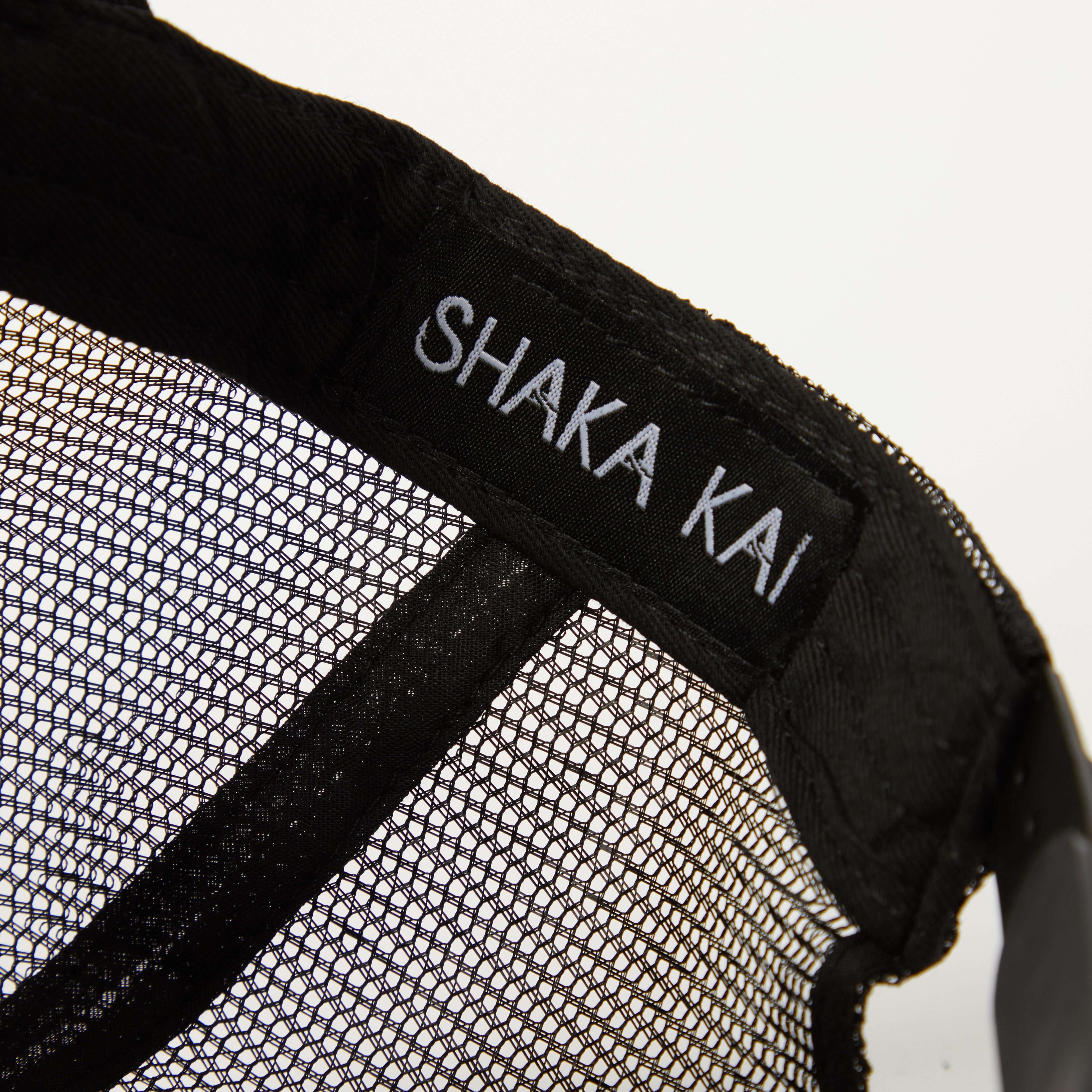 Close-up of the interior label of the Suds & Duds Trucker Hat featuring SHAKA KAI.