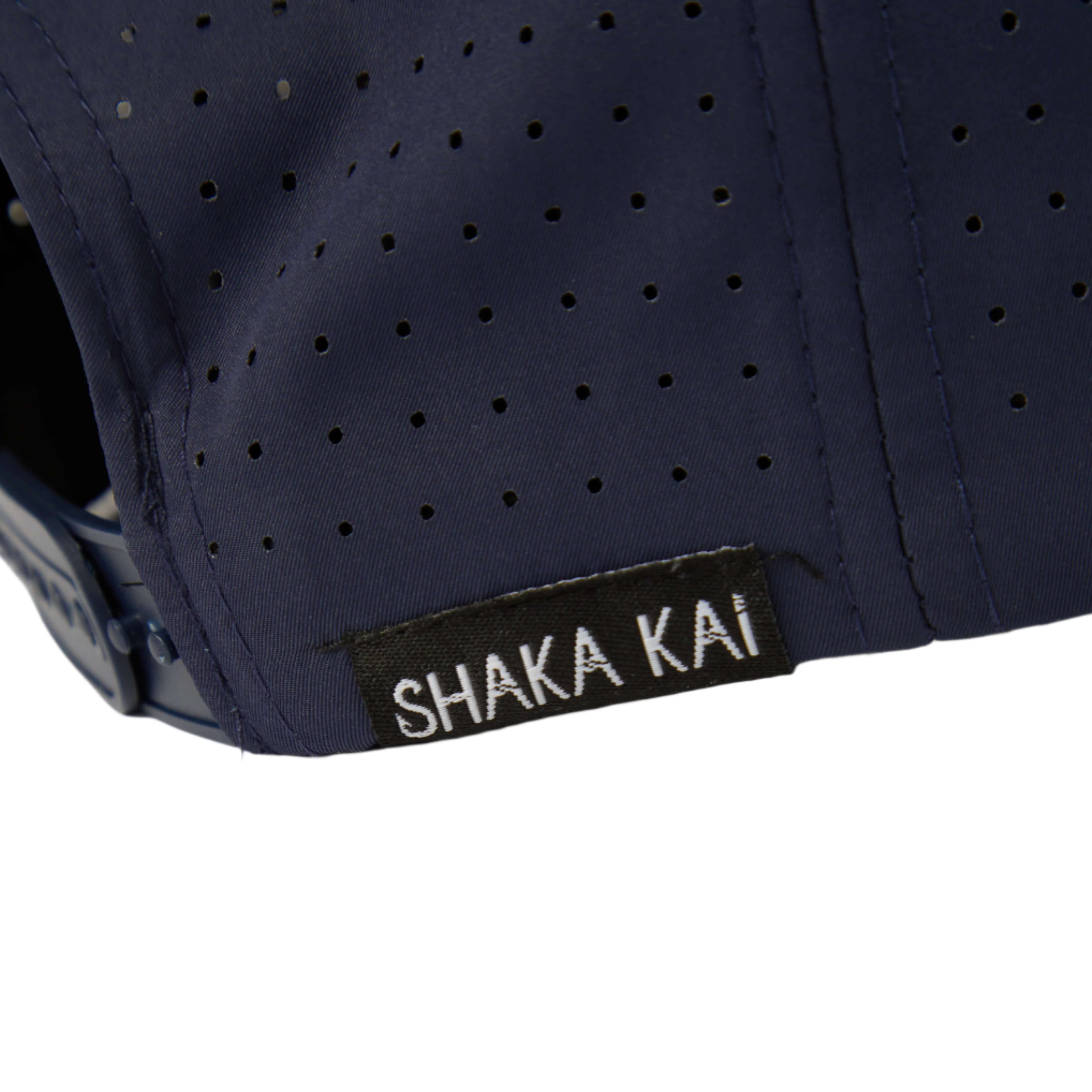 Close-up of the DaveL Shaka-Shimi Mahi Ultra Fit hat, featuring the Shaka Kai label and breathable tech fabric.