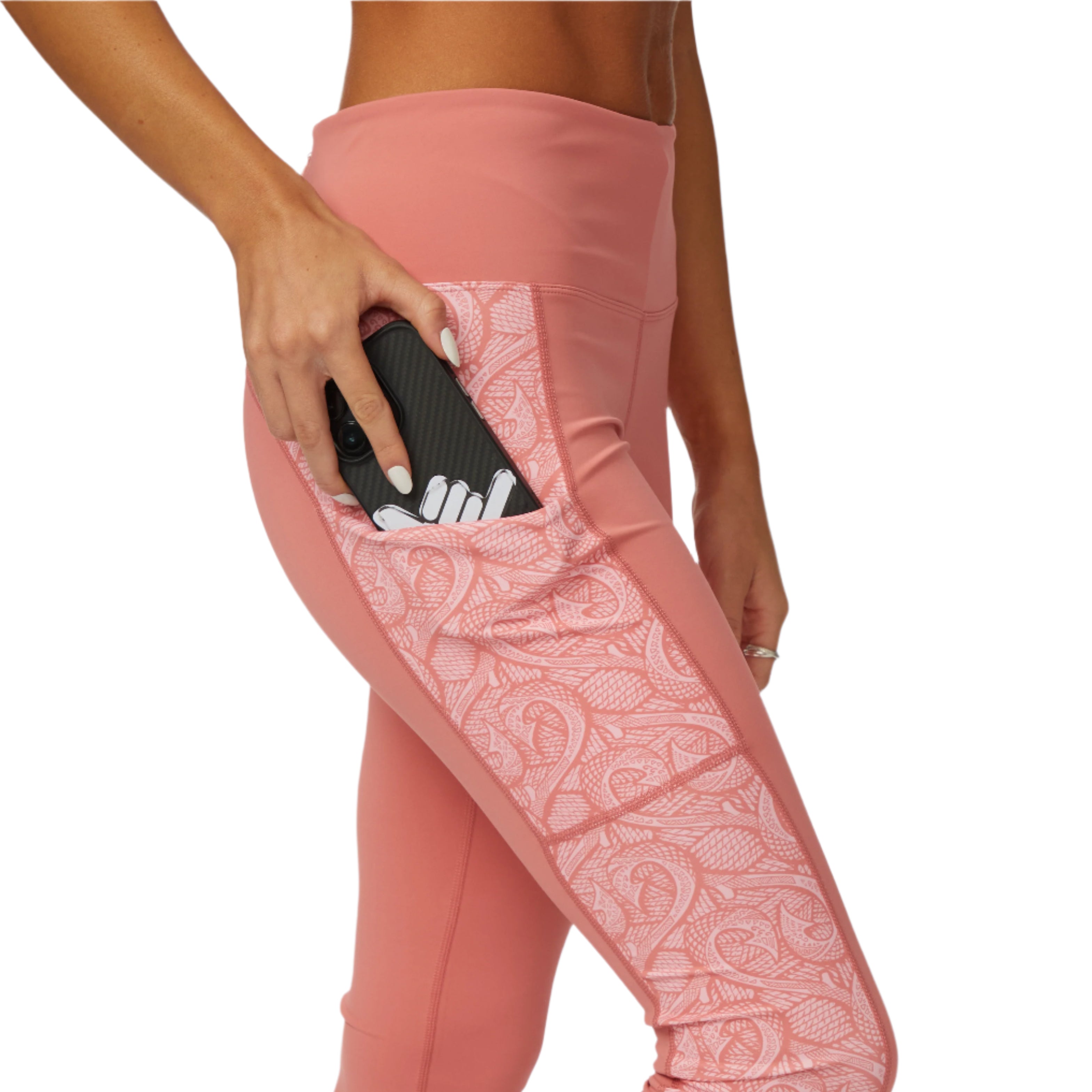 Woman wearing Makau Leggings with a phone in the side pocket, showcasing comfort and functionality.