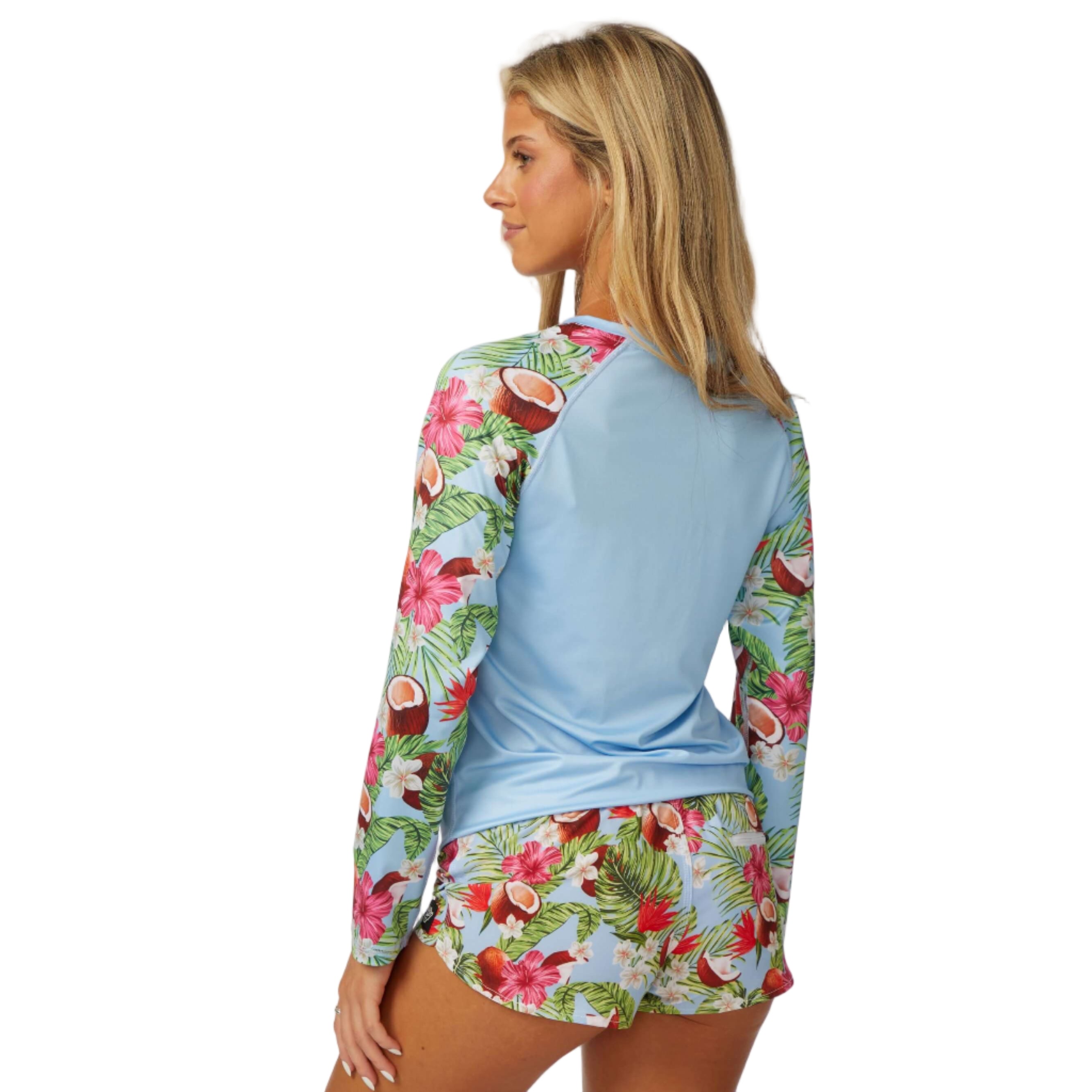 Coco Loco LS Performance Shirt UPF 50 displayed on a model, showcasing tropical design and sun protection features.