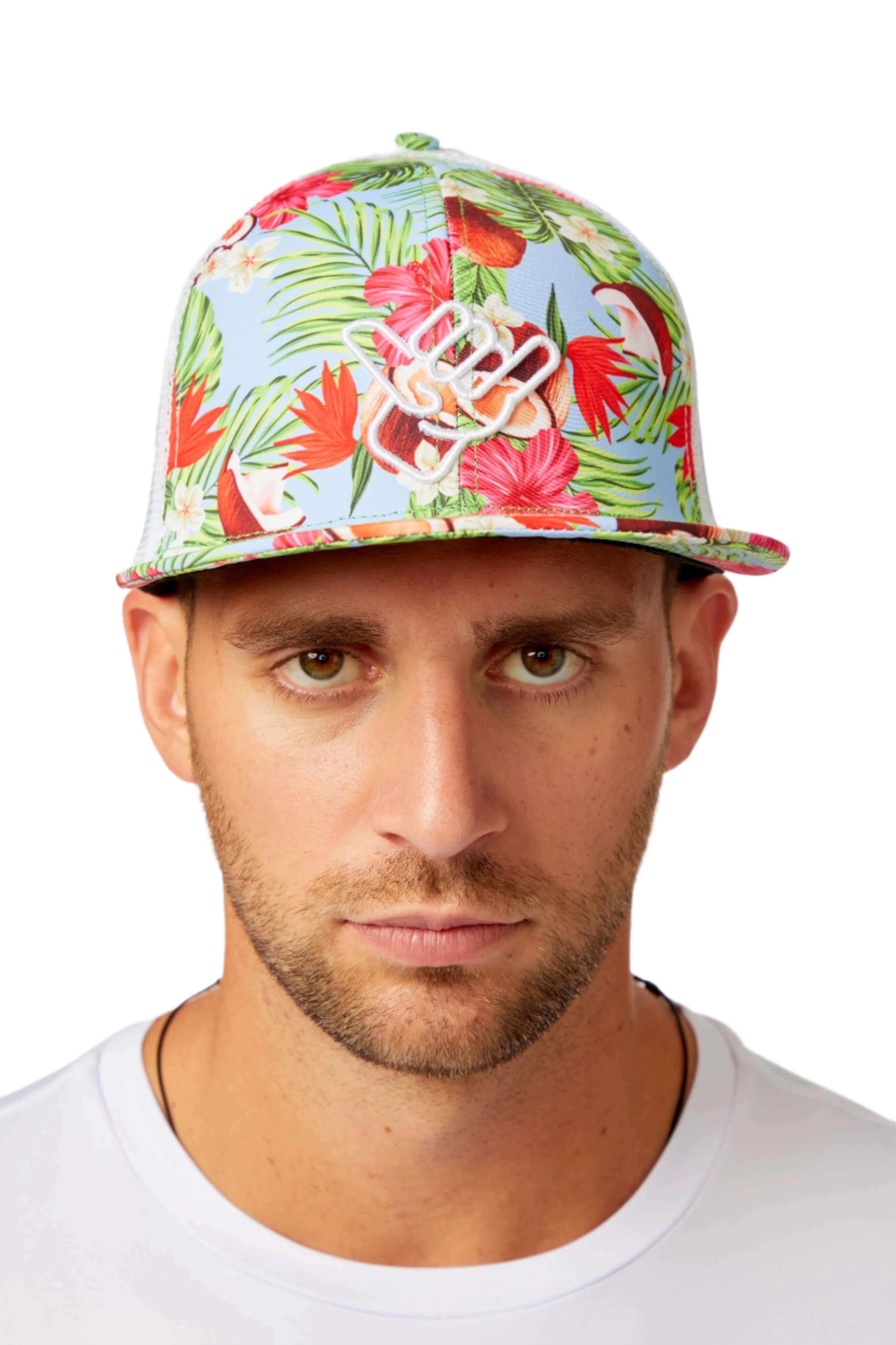 Coco Loco Trucker Hat featuring vibrant tropical floral design, perfect for beachside adventures and sunny days.