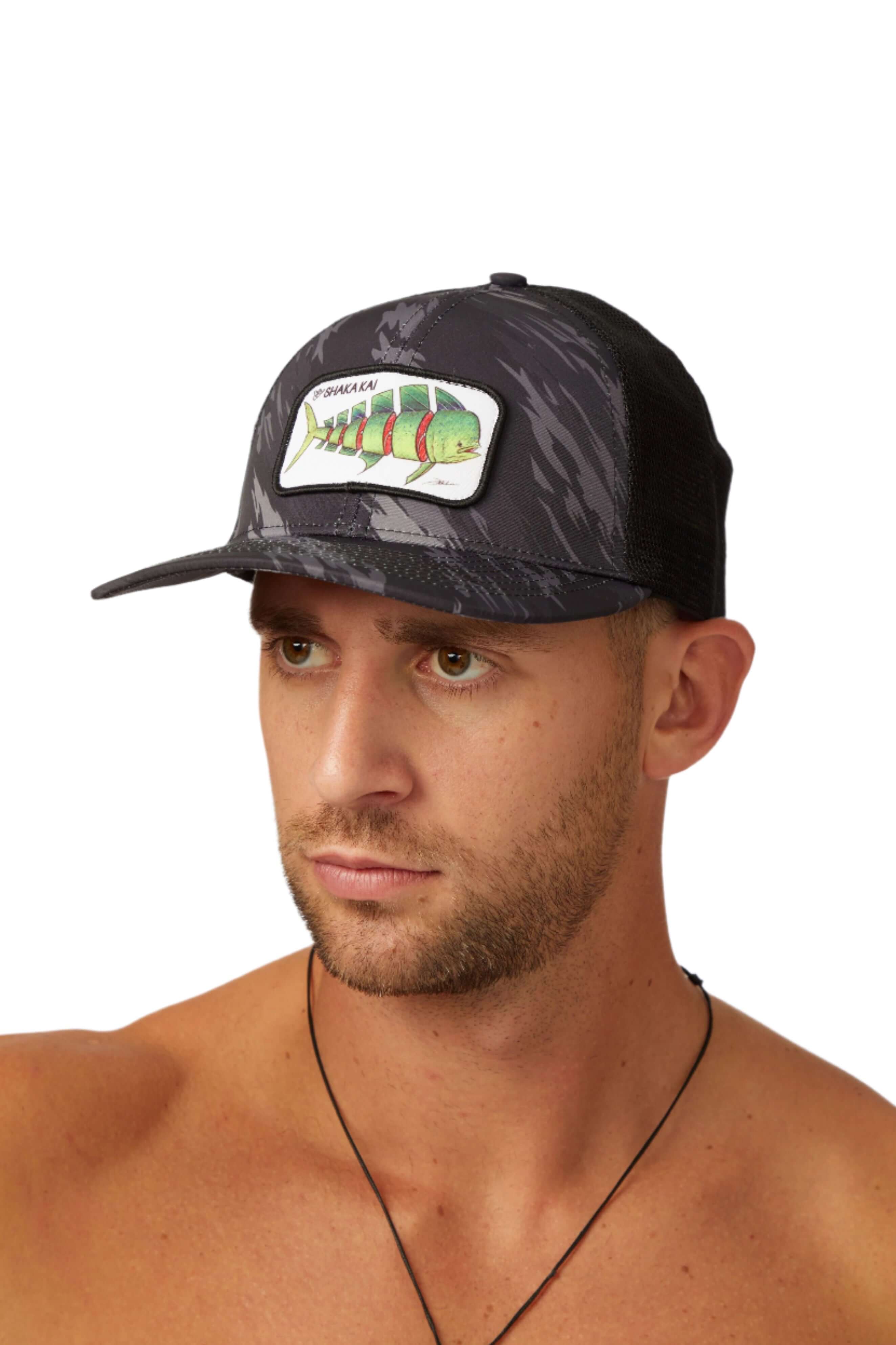 DaveL Shaka-Shimi Mahi Trucker hat with mahi mahi print, on a model showcasing coastal streetwear style.