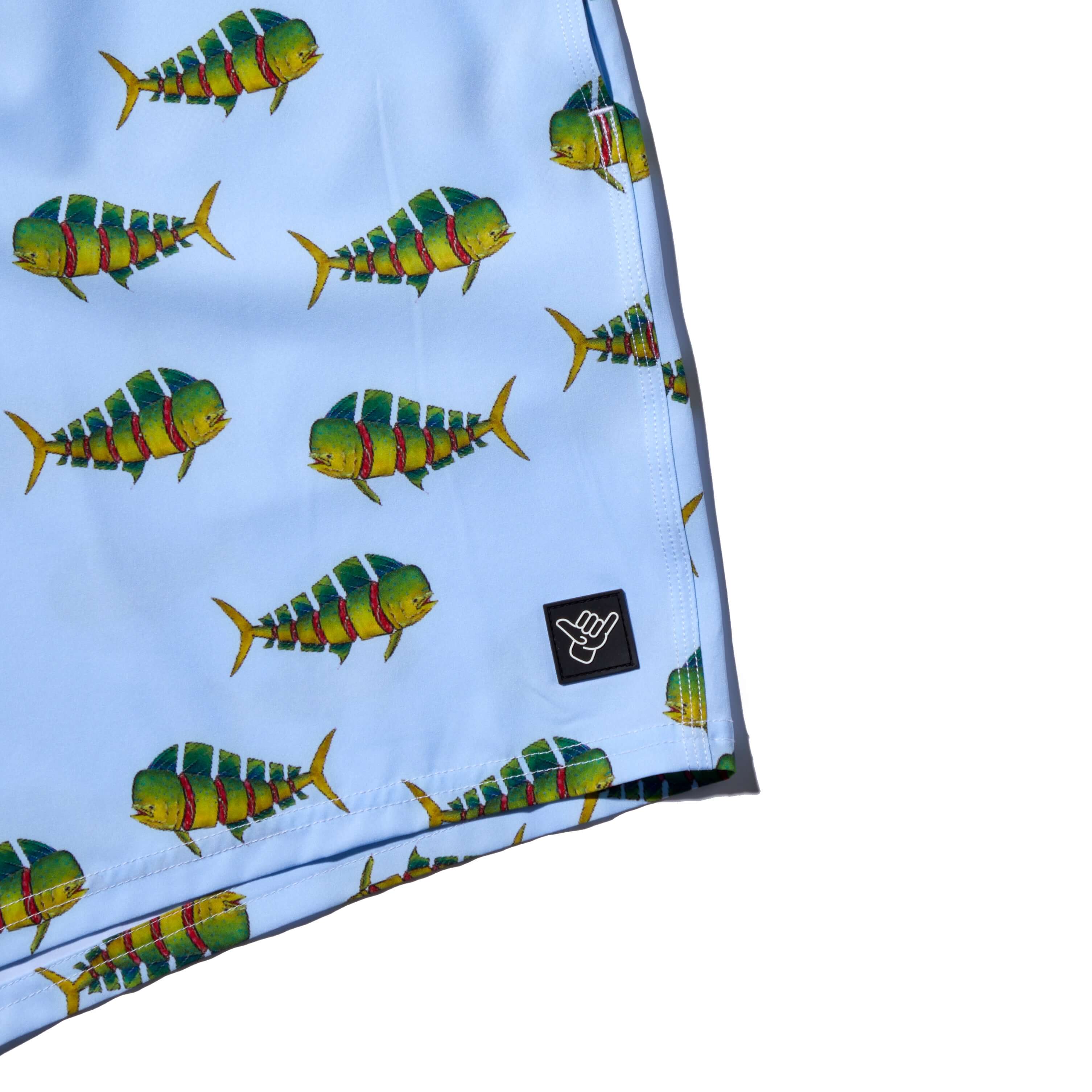 DaveL Shaka-Shimi Mahi Volley Short featuring vibrant mahi-mahi artwork on a blue background.